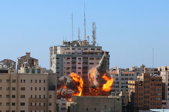 A tower housing AP, Al Jazeera offices collapses after Israeli missile strikes in Gaza city